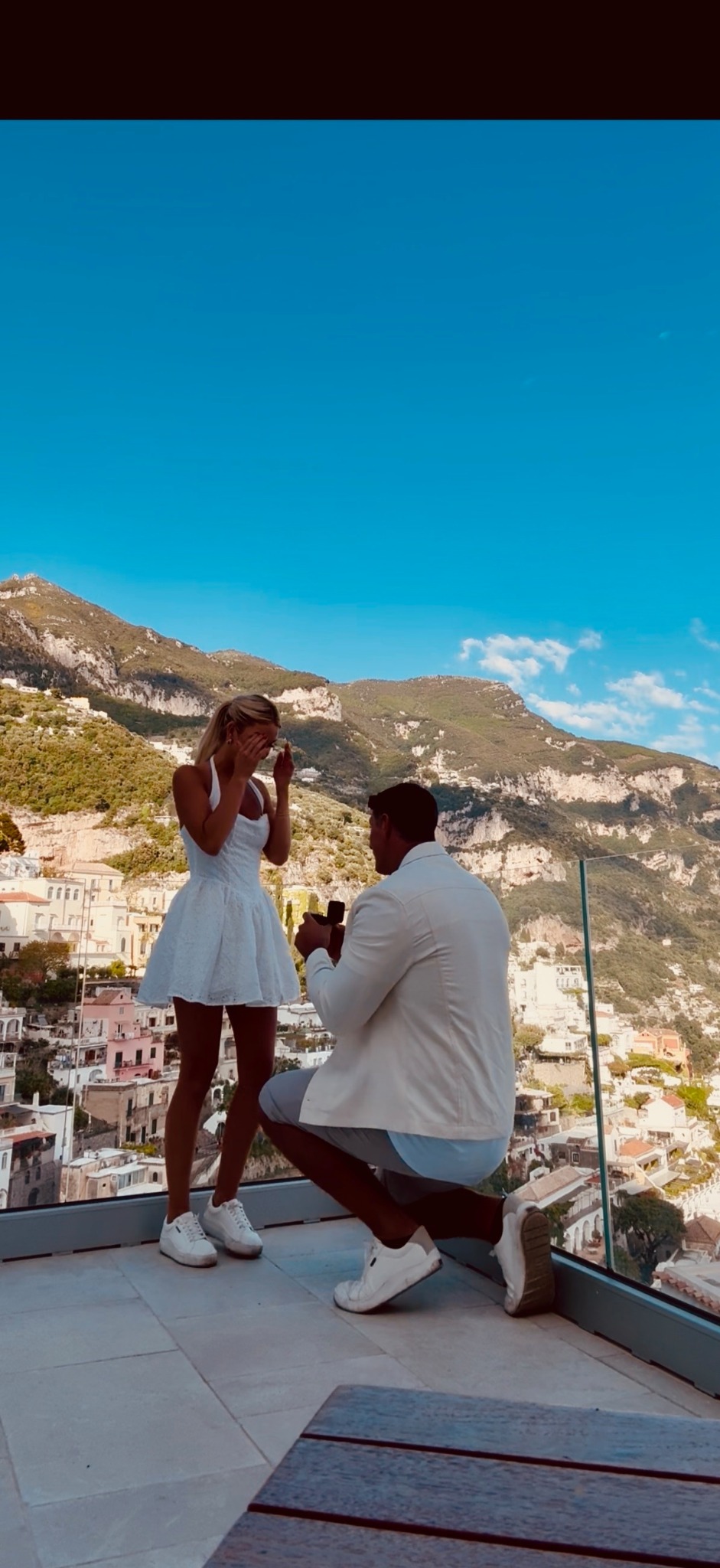 Summer and Devin during their proposal overlooking the coast